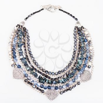 gray blue agate necklace from natural gemstones (Dragon Veins Agate, shell, silk jasper, hematite, labradorite beads) on white background
