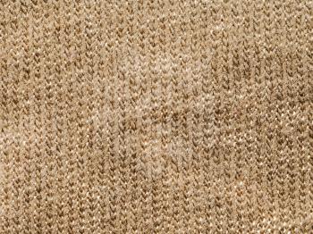 textile background - brown cotton fabric with Jersey (stockinette) Structure weave pattern of threads close up