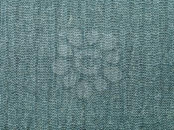 textile background - gray green silk fabric with Crepon weave pattern of threads close up
