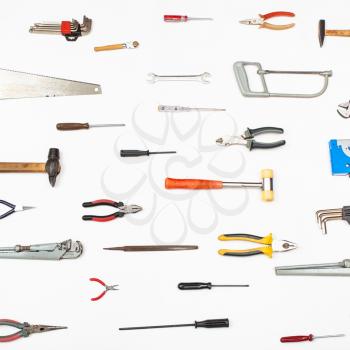 many small tools arranged on white background