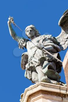 travel to Italy - statue of Michael the Archangel close up on Castle of Holy Angel in Rome city. This statue was made in 1753 by Peter Anton von Verschaffelt