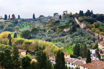 travel to Italy - above view of gardens and wall of Giardino Bardini from Piazzale Michelangelo in Florence city in autumn evening