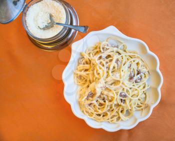 travel to Italy, italian cuisine - above view of spaghetti alla carbonara on plate in Sicily