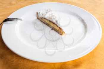 travel to Italy, italian cuisine - piece of traditional sicilian sweet lemon cake on white plate in Sicily
