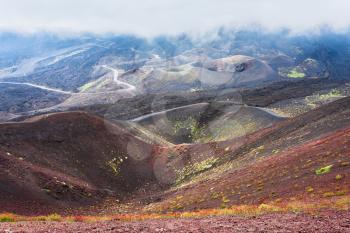 travel to Italy - cloud over craters on Mount Etna in Sicily in summer day