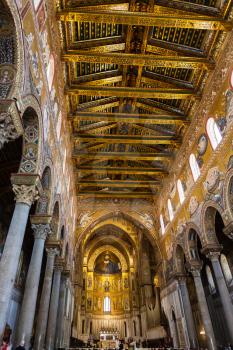 MONREALE, ITALY - JUNE 25, 2011: interior of Duomo di Monreale in Sicily. The cathedral of Monreale is one of the greatest examples of Norman architecture, it was begun in 1174