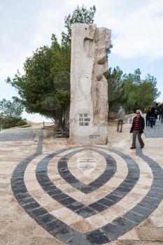 MOUNT NEBO, JORDAN - FEBRUARY 20, 2012: tourists near Monument in honor of Pope visit Mount Nebo in Holy Land. Mount Nebo is the place where Moses was granted a view of the Promised Land.