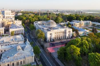 KIEV, UKRAINE - MAY 4, 2017: above view of Mykhailo Hrushevskyi street with Verkhovna Rada building (Supreme Council of Ukraine) and Dnieper River on horizon in spring dawning