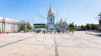 KIEV, UKRAINE - MAY 5, 2017: St Michael's Square with tourists and Easter eggs in front of Saint Michael's Golden-Domed Monastery in Kiev city. The monastery was founded in 1108-1113
