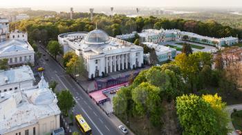 KIEV, UKRAINE - MAY 6, 2017: Hrushevsky street and Verkhovna Rada building (parliament house) with Mariyinsky palace in Mariinsky park and Dnieper River on horizon in spring twilight