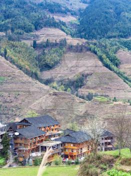 travel to China - view of houses in village in terraced fields of Dazhai Longsheng Rice Terraces (Dragon's Backbone terrace, Longji Rice Terraces) country