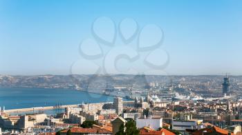 Travel to Provence, France - above view of Marseilles city and port under blue sky