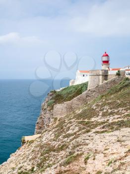 Travel to Algarve Portugal - lighthouse on cape St Vincent ( lighthouse of sao vicente, fortaleza do cabo de sao vicente) near Sagres town