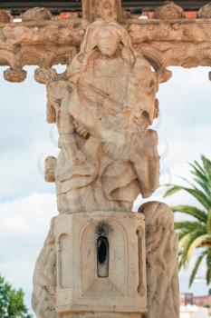 Travel to Algarve Portugal - Pieta on The Cruz de Portugal (Cross of Portugal) on square. It is monument in Silves city classified as a National Monument since 1910