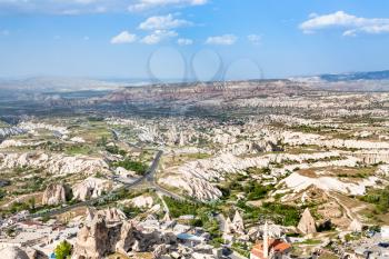 Travel to Turkey - above view of Uchisar village and roads in valley in Nevsehir Province in Cappadocia in spring
