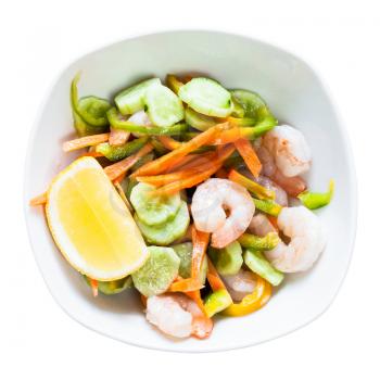 Indian cuisine - prawn salad from vegetables and shrimps in bowl isolated on white background