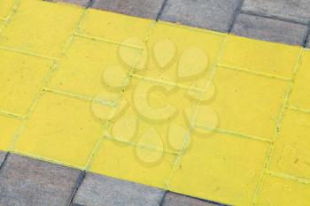 wide painted yellow line on pavement close up