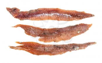 three single oiled anchovy fillets isolated on white background