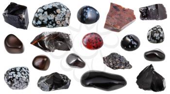 set of various Obsidian (volcanic glass) natural mineral gem stones and samples of rock isolated on white background