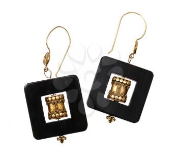 handmade earrings from traditional indian brass items and horn frame isolated on white background