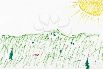 green grass on meadow under yellow sun hand-drawn by felt pens on white paper