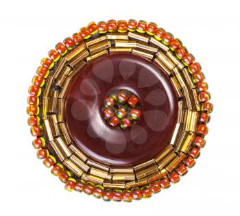 handcrafted round brown leather brooch decorated by glass beads and bugles isolated on white background