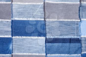 textile background - patchwork from many various denim flaps