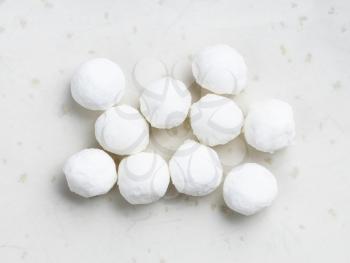 several raw tapioca pearls close up on gray ceramic plate