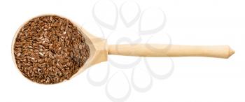 top view of wood spoon with brown flax seeds isolated on white background