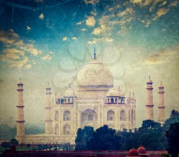 Vintage retro hipster style travel image of Taj Mahal on sunrise sunset, Indian Symbol - India travel background  with grunge texture overlaid. Agra, Uttar Pradesh, India