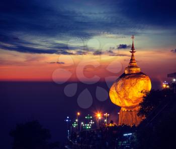 Vintage retro effect filtered hipster style image of Golden Rock - Kyaiktiyo Pagoda - famous Myanmar landmark, Buddhist pilgrimage site and tourist attraction, Myanmar