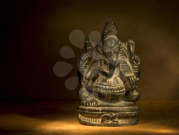 Hindu God Gunesh figure in a darkness.