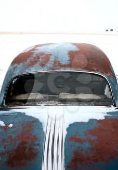 Antique abandoned car pontiac in winter canada