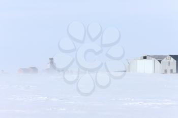 Town and Grain Elevator in Blizzard Saskatchewan 
