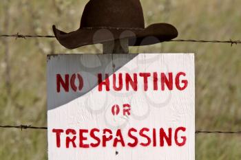 Cowboy hat over posted sign in Saskatchewan