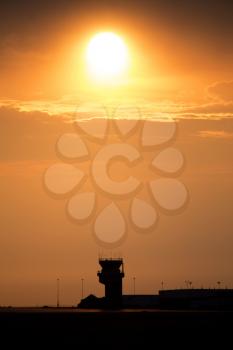 Sunset Orange Sillouette and Flight Tower Canada