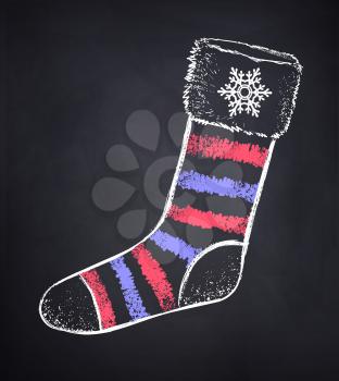 Vector chalked illustration of striped Christmas sock on black chalkboard background.