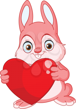 Cute pink bunny holding a heart