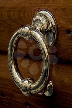 gold copper cnocker in a door in verona italy