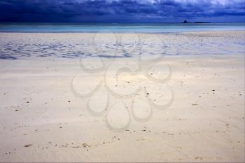 beach sky sand isle and rock in indian ocean madagascar