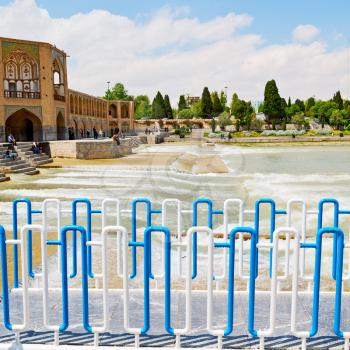 blu in iran  the old bridge and the river antique construction near nature