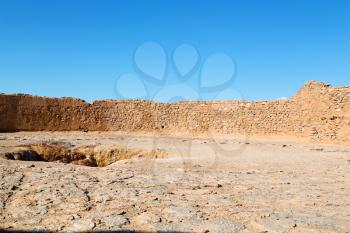 blur in iran near yazd the antique zoroastrian temple abandonated house and contruction