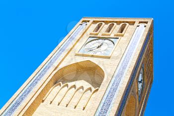 in iran old yazd city and  the antique brick    clock  tower near the sky