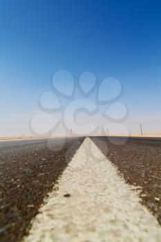  the asphalt empry street and loneliness in oman near the old desert