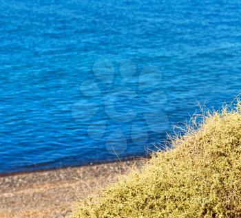 in      greece  the  mykonos island rock sea and beach    sky