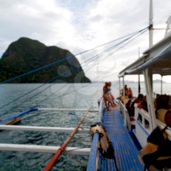 blur  in  philippines   view of the island hill from the prow of a boat