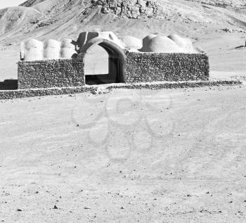 blur in iran near yazd the antique zoroastrian temple abandonated house and contruction