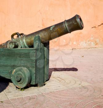 in africa morocco  green bronze cannon and the blue sky