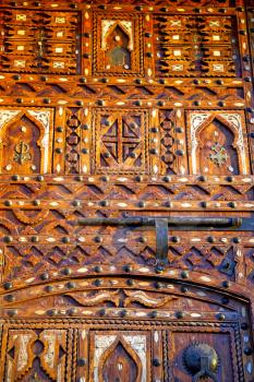 metal grey   morocco in    africa the old wood  facade home and rusty safe padlock 