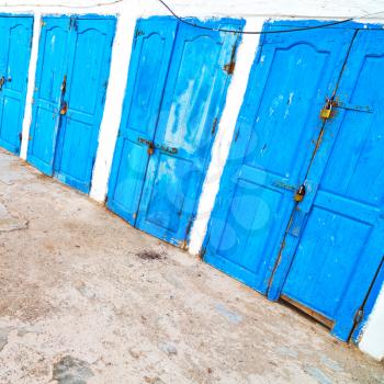 in africa morocco  old harbor wood   door and the blue sky